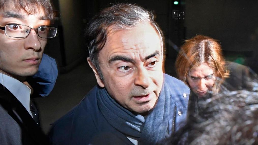 In this April 3, 2019, file photo, former Nissan Chairman Carlos Ghosn, center, leaves his lawyer's office in Tokyo.{&nbsp;} (Sadayuki Goto/Kyodo News via AP, File)