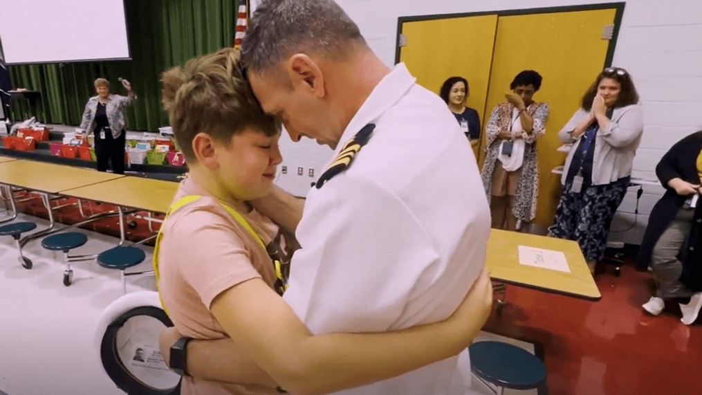 Ethan, a fifth-grade student at Rosa Parks Elementary School, embraces his father during a surprise reunion.{&nbsp;}(Photo courtesy of Prince William County Schools)