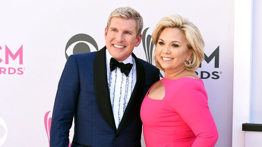 FILE - Todd Chrisley, left, and his wife, Julie Chrisley, pose for photos at the 52nd annual Academy of Country Music Awards on April 2, 2017, in Las Vegas. Todd and Julie Chrisley were driven by greed as they engaged in an extensive bank fraud scheme and then hid their wealth from tax authorities while flaunting their lavish lifestyle, federal prosecutors said, arguing the reality television stars should receive lengthy prison sentences. They were found guilty on federal charges in June and are set to be sentenced by U.S. District Judge Eleanor Ross in a hearing that begins Monday, Nov. 21. (Photo by Jordan Strauss/Invision/AP, File)