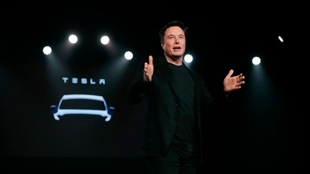 In this March 14, 2019, file photo Tesla CEO Elon Musk speaks before unveiling the Model Y at Tesla's design studio in Hawthorne, Calif. Shares of electric vehicle maker Tesla Inc. fell at the opening bell Thursday, May 23 but recovered into positive territory after an analyst predicted falling demand but Musk told employees that orders are up. The gyrations within an hour of when the markets opened were indicators of a volatile day for the shares, which have shed about 40 percent of their value this year and are trading at the lowest levels since late 2016.  (AP Photo/Jae C. Hong, File)