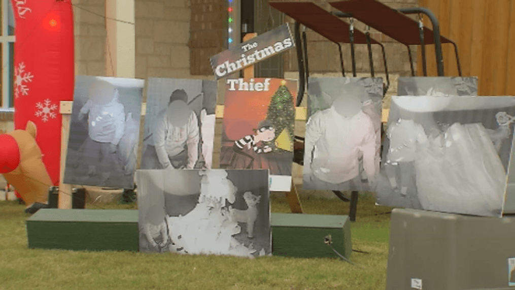 Man decorates with surveillance photos. (WOAI)