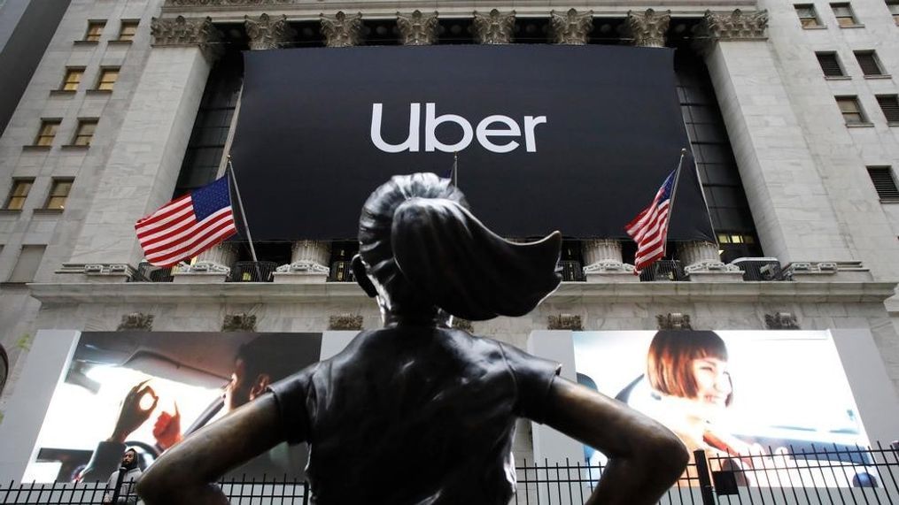 FILE - In this May 10, 2019, file photo the statue of Fearless Girl stands in front of the New York Stock Exchange before Uber holds its initial public offering. Uber reports financial results Monday, Nov. 4. (AP Photo/Mark Lennihan, File)