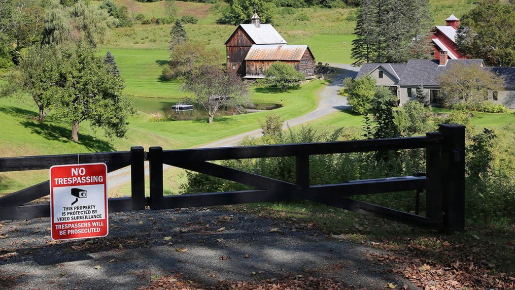 FILE - A no-trespassing sign hangs on a gate outside a private property, Thursday, Sept. 21, 2023, in Pomfret, Vt., that has become a destination for fall foliage viewers, clogging a narrow rural road. (AP Photo/Lisa Rathke)