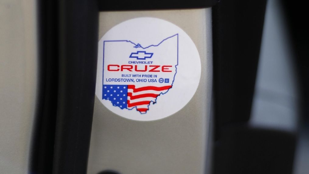 A sticker on the door of a Chevrolet Cruze, showing it was made in Lordstown, Ohio, is shown in Detroit, Thursday, Feb. 16, 2017. The UAW union is working on an advertising campaign that urges people to buy U.S.-made cars and trucks in an effort to build on what the union sees as nationalistic sentiment that President Donald Trump tapped into during the election. (AP Photo/Paul Sancya)