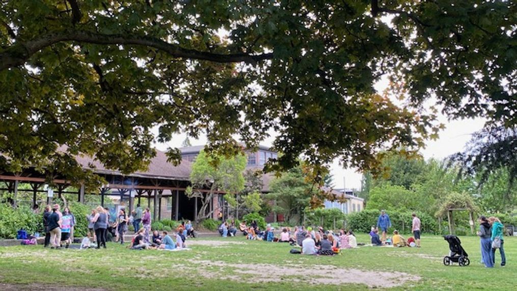 The waft of garlic welcomed a crowd of new friends at Seattle's Meridian Park on this happy Monday afternoon in Wallingford. After a poster for the event{&nbsp;}{a href="https://www.tiktok.com/@fendihendrixx/video/7368103963775749418?lang=en" target="_blank"}went viral on TikTok{/a}{&nbsp;}with over 4 million views and a promise of simplistic joy, locals gathered just as advertised for Gays Eating Garlic Bread in a Park! We obviously had to check it out and this event did not disappoint. I was promptly greeted by a friendly face and offered garlic bread upon arrival (the homemade spread was delicious)! The welcoming and diverse crowd stretched from organizers to folx joining solo or with pals, plus tiny tots, cute dogs and garlic bread galore - along with free drinks, sides of fruit, spaghetti, tons of games and generally awesome vibes. It was a very Seattle Monday, in the best way.{&nbsp;}{a href="https://www.tiktok.com/@seattlerefined/video/7368706807155412266?lang=en" target="_blank"}View our TikTok here{/a}. (Image: Seattle Refined) May 13, 2024{&nbsp;}