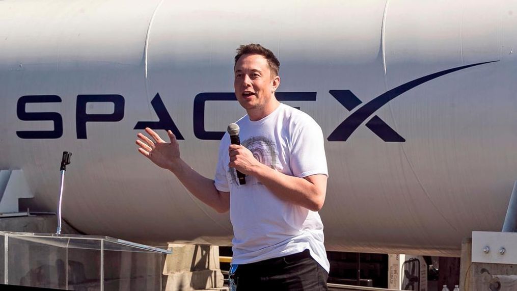 In this Aug. 27, 2017 file photo, SpaceX CEO Elon Musk congratulates teams competing on the Hyperloop Pod Competition II at SpaceX's Hyperloop track in Hawthorne, Calif. A committee of the Los Angeles City Council on Wednesday, April 18, 2018, approved an environmental review exemption for a Los Angeles-area tunnel that Elon Musk wants to dig to test a novel underground transportation system. (AP Photo/Damian Dovarganes, File)