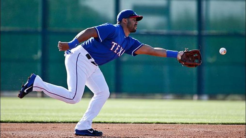 Russell Wilson works out with the Texas Rangers during spring training in 2015 in Surprise, Arizona (AP Photo){p}{/p}