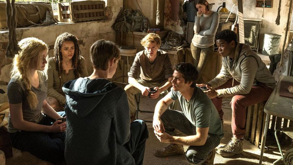 The group decides on its next move. (L-R) Sonya (Katherine McNamara), Harriet (Nathalie Emmanuel), Aris (Jacob Lofland, back to camera), Newt (Thomas Brodie-Sangster), Thomas (Dylan O’Brien), Brenda (Rosa Salazar), and Frypan (Dexter Darden).&nbsp;(Joe Alblas/Twentieth Century Fox)