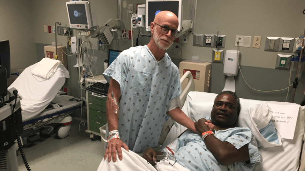 At 6:30 a.m. Monday morning, surgeon Joseph Melanson explained to Charlie Ball, the donor, left, and Kenneth Walker, the recipient, how the kidney transplant was going to work. (Sam Ford/ABC7)