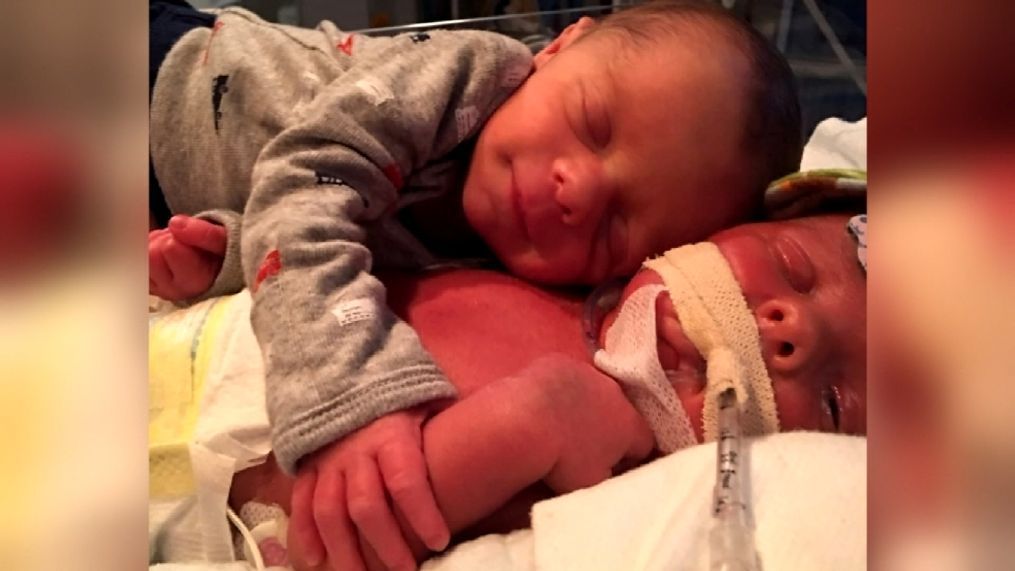 Photos of two hugging newborns, brothers Mason and Hawk, are bringing smiles to people worldwide, but it's their story that may bring you to tears. (Photo used with family permission)