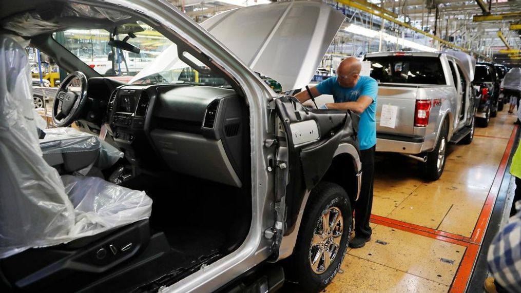 In this Sept. 27, 2018, file photo a United Auto Workers assemblyman works on a 2018 Ford F-150 truck being assembled at the Ford Rouge assembly plant in Dearborn, Mich. Ford Motor Co. reports financial results Wednesday, Jan. 23, 2019. (AP Photo/Carlos Osorio, File)