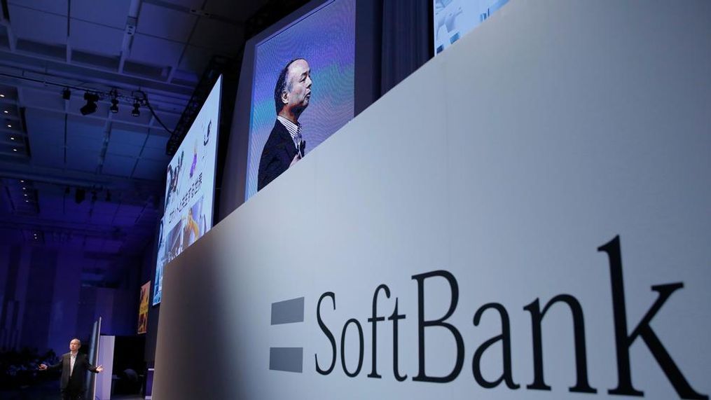 FILE - In this July 20, 2017, file photo, SoftBank Group Corp. Chief Executive Officer Masayoshi Son, left, speaks during a SoftBank World presentation at a hotel in Tokyo.  SoftBank will spend $2.25 billion for a nearly a 20 percent stake in General Motors’ autonomous vehicle unit. GM said Thursday, May 31, 2018, that it will also sink another $1.1 billion into Cruise Automation. The capital infusion is designed to speed large-scale deployment of self-driving robotaxis next year. (AP Photo/Shizuo Kambayashi, File)