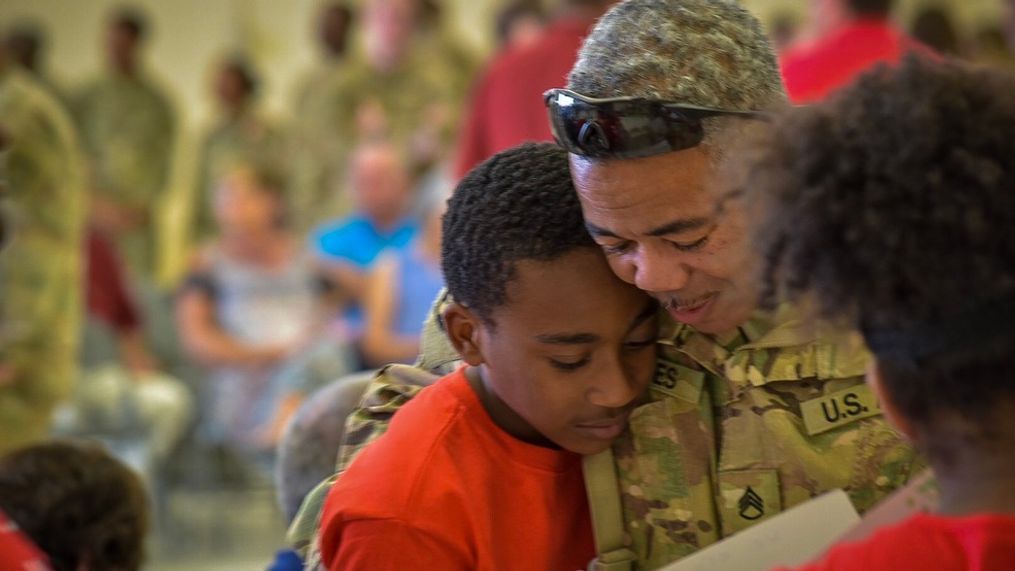 Staff Sergeant Douglas Eaves is greeted by his son James after a ten month deployment in Kuwait. (Stephen Quinn | abc3340.com)