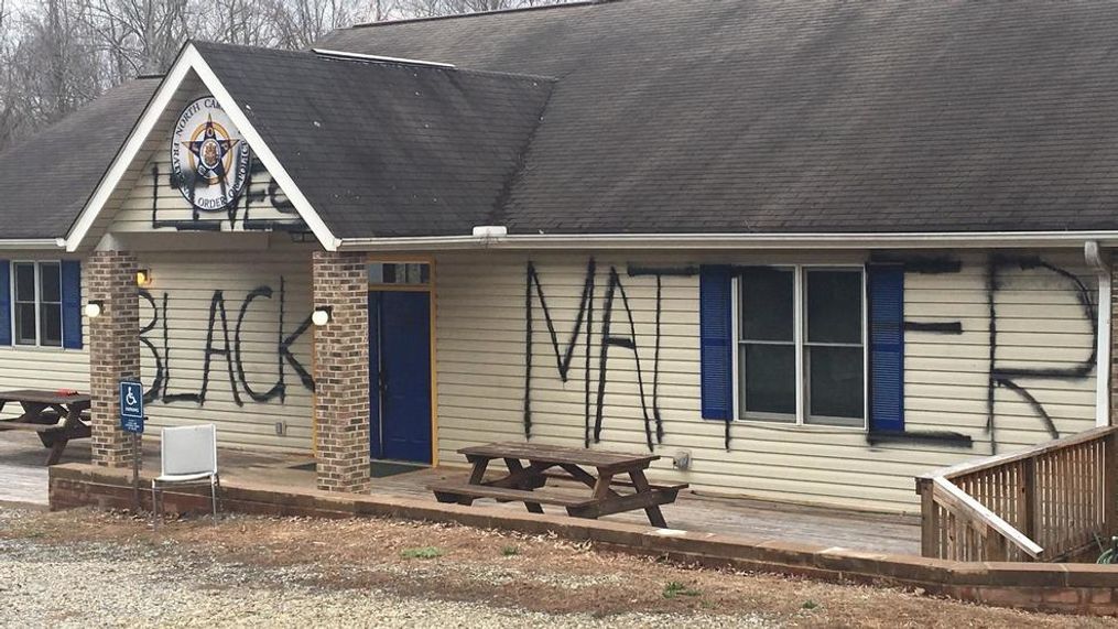 The Fraternal Order of Police lodge in Asheville has been vandalized, with "Black Lives Matter" spray-painted on the exterior. (Photo credit: WLOS Staff)