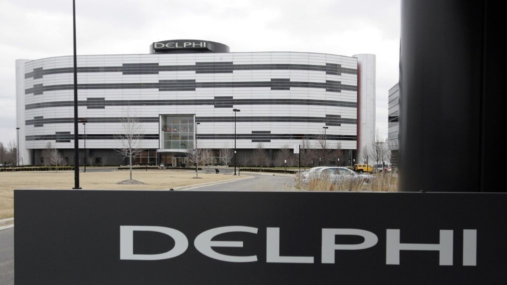 World Headquarters in Troy, Mich. Automotive parts and electronics maker Delphi Corp. is the latest partner to join BMW, Intel and Mobileye to develop autonomous vehicles. The companies announced Tuesday, May 16, 2017, that Delphi will work with the companies to integrate autonomous driving systems. They plan to have a self-driving system ready by 2021. (AP Photo/Carlos Osorio, File)