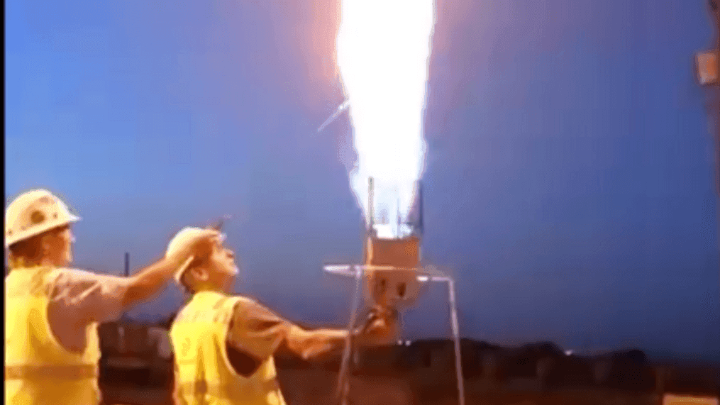 Manager creates flaming hot dog cooker to demonstrate fire safety. (Gary Dykman){br}