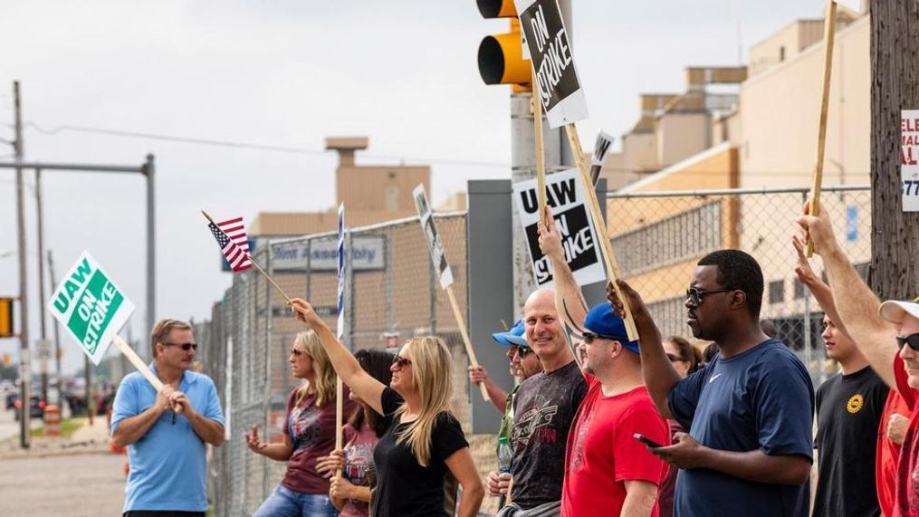 Union members stand outside of the General Motors Flint Assembly Plant on Van Slyke Road on Tuesday, Sept. 17, 2019 in Flint, Mich. United Automobile Workers remain on strike against GM. GM and the union are negotiating at a time of troubling uncertainty for the U.S. auto industry. (Sara Faraj/MLive.com/The Flint Journal via AP)