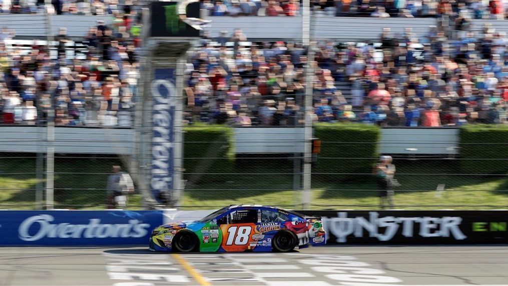 Kyle Busch crosses the finish line to win the NASCAR Cup Series auto race at Pocono Raceway, Sunday, July 30, 2017, in Long Pond, Pa. (AP Photo/Matt Slocum)