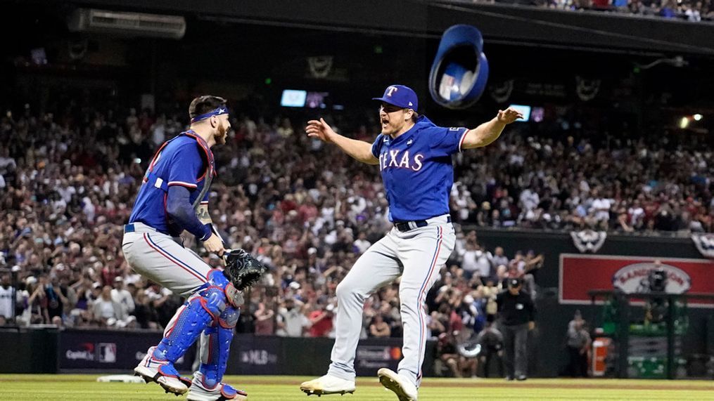 Texas Rangers catcher Jonah Heim, left, and relief pitcher Josh Sborz celebrate after Game 5 of the baseball World Series against the Arizona Diamondbacks Wednesday, Nov. 1, 2023, in Phoenix. (AP Photo/Godofredo A. Vasquez)