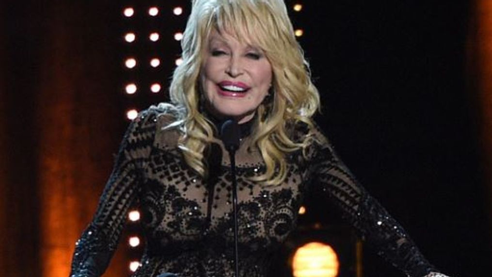 FILE: Dolly Parton accepts her award at MusiCares Person of the Year on Friday, Feb. 8, 2018, at the Los Angeles Convention Center. (Photo by Chris Pizzello/Invision/AP)