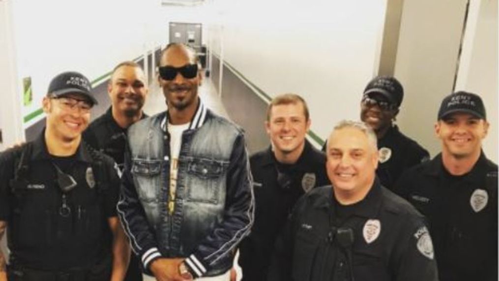 Snoop Dogg posed with Kent police officers. The rapper performed at the ShoWare Center on Saturday, April 21, 2018. (Photo: Kent Police Department){p}{/p}