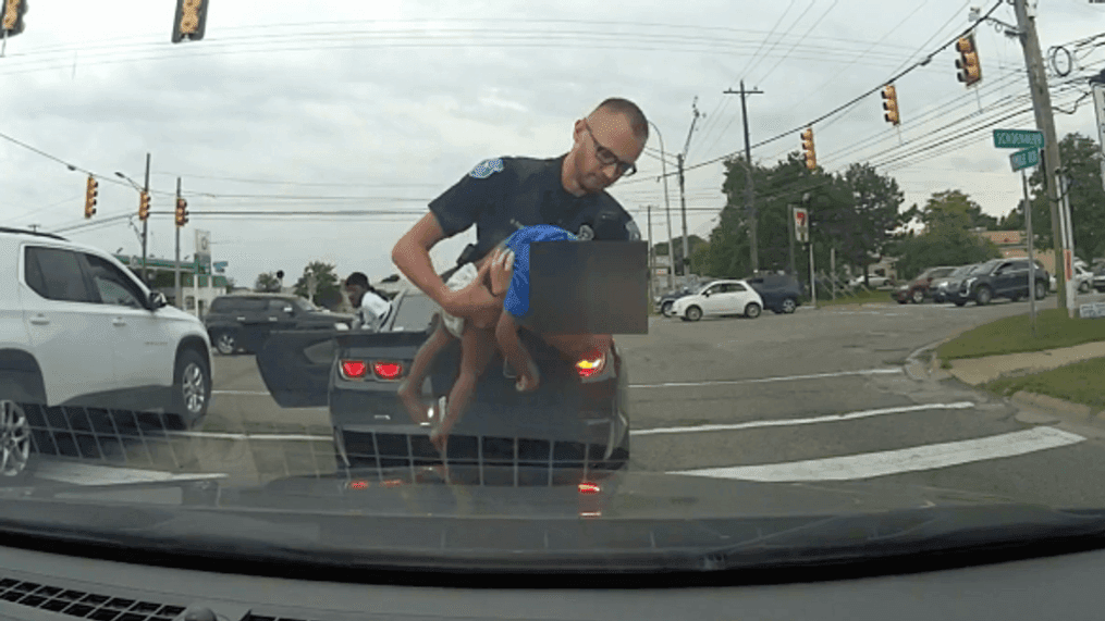 An 18-month-old child struggling to breathe is saved by an officer during a traffic stop in Warren, Wis. (Screenshot from video courtesy of Warren Police Department)