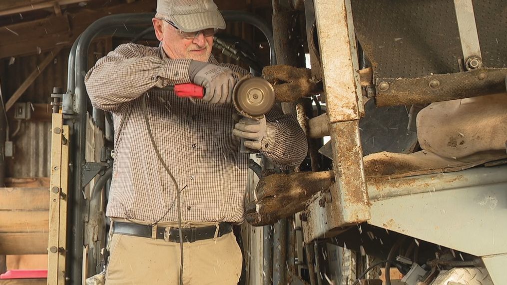 Twice a year, dairy cow hoof trimmer John Hall travels from Statesville to Small Acres Dairy Farm in Mills River, which has one of the smaller herds of Jersey dairy cows in Western North Carolina. (Photo credit: WLOS staff)