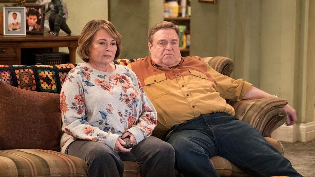 FILE - In this image released by ABC, Roseanne Barr, left, and John Goodman appear in a scene from the reboot of "Roseanne." (Adam Rose/ABC)