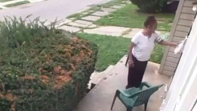 Image for story: WATCH: Woman finds dog poop in her yard, smears it on neighbor's door handle  