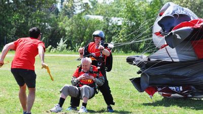 Image for story: World War II veteran jumps out of plane during Parachute for Polio event