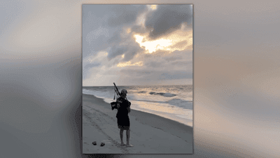 Image for story: VIDEO: Musician plays 'Amazing Grace' on bagpipes during beach sunrise