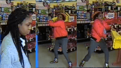 Image for story: Police: Woman in shower cap assaults employee with wet floor sign during robbery