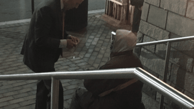 Image for story: Joe Biden takes time to speak with homeless man outside DC theater, bystander says 