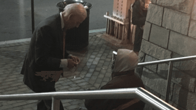 Image for story: Joe Biden takes time to speak with homeless man outside DC theater, bystander says 