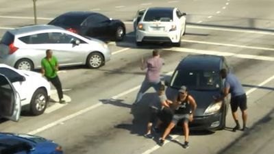 Image for story: Good Samaritans stop moving car to help driver suffering medical emergency