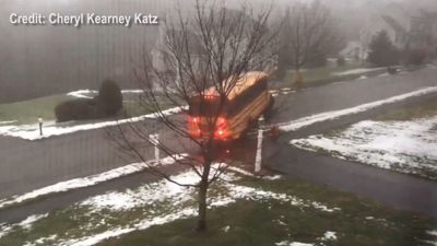 Image for story: VIDEO: School bus slides down icy hill in Massachusetts, crashes into car