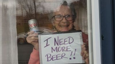 Image for story: 10 cases of beer dropped off for 93-year-old who went viral with beer sign 