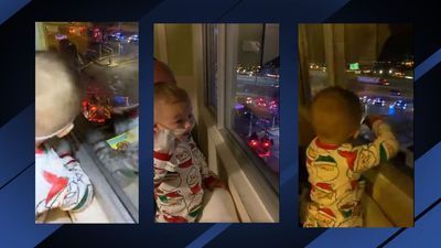 Image for story: 'Hey Santa': Boy reacts excitedly as he views Santa from hospital window