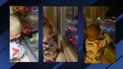 Image for story: 'Hey Santa': Boy reacts excitedly as he views Santa from hospital window