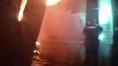 Image for story: Police pull person from burning home in Georgia