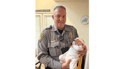 Image for story: New Jersey police officer reunites with baby girl he helped deliver