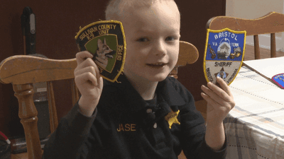 Image for story: Virginia boy inspires law enforcement by collecting patches from his heroes