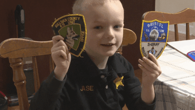 Image for story: Virginia boy inspires law enforcement by collecting patches from his heroes