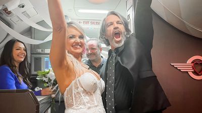 Image for story: Couple trying to get to Las Vegas wedding chapel marry on their flight instead