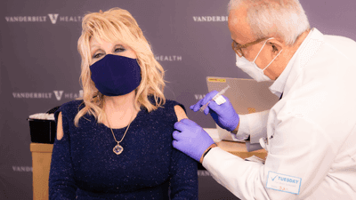 Image for story: Dolly Parton gets vaccinated for COVID-19 with a 'dose of her own medicine' 