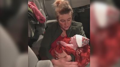 Image for story: Asheville couple delivers baby in backseat of family van