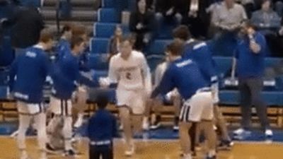 Image for story: 8-year-old impresses with pregame handshakes at high school basketball game in Michigan