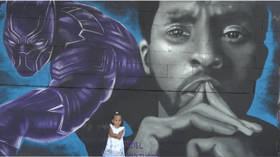 Image for story: Dallas artist paints 'Wakanda Forever Mural' to honor actor Chadwick Boseman