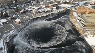 Image for story: Giant spinning ice disk draws crowd of chilly onlookers in Maine