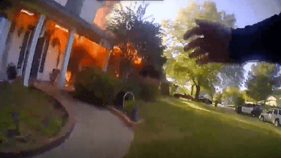 Image for story: Bodycam video shows Conway police officer running into burning home